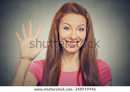 Closeup portrait, young excited woman, making five times sign gesture with hand fingers, isolated grey wall background. Positive human emotion facial expression feeling, attitude, symbol body language