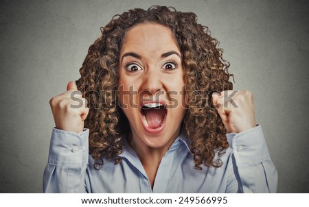 Closeup portrait headshot angry young woman having nervous breakdown screaming isolated grey wall background. Negative human emotion facial expression feeling attitude