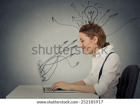 Side view profile attractive happy business woman working on laptop computer isolated grey wall background. Internet creativity network concept