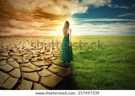 A Climate Change Concept Image. Landscape of a green grass and extreme dry drought land