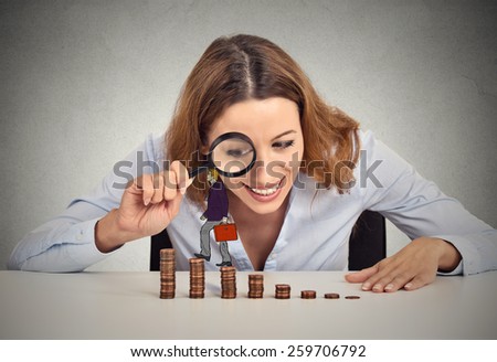 Businesswoman sitting at office table looking at corporate employee walking up coin stack ladder. Government control regulation concept