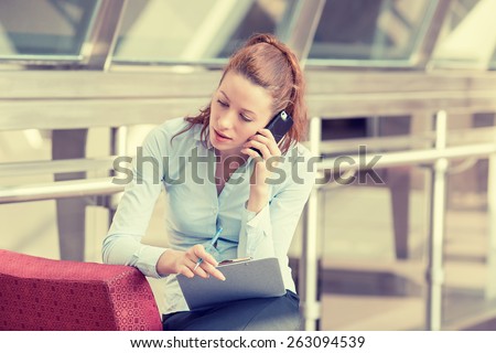 Portrait unhappy young woman talking on mobile phone looking down. Human face expression, emotion, bad news reaction