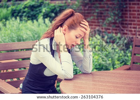 portrait stressed sad young woman outdoors. City urban life style stress