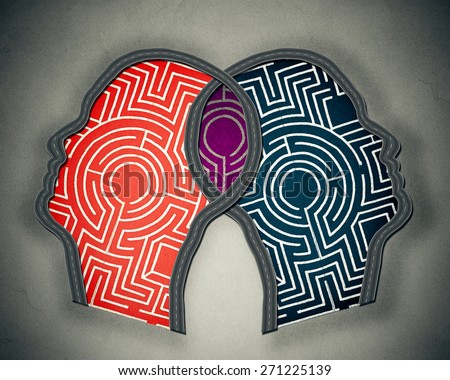 Complicated relationship as concept for group therapy or marriage counseling as two human heads made from maze merging together as icon of partnership solutions isolated gray background