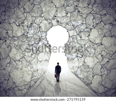 Management solutions concept leadership symbol. Business man walking to glowing key hole shape opening as path to success through crushed and crumpled office paper. Strategy visionary path