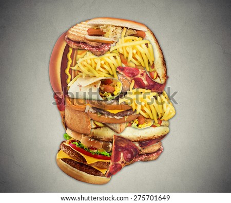Unhealthy diet health concept with group of greasy fast food in shape of human head symbol of dangerous eating lifestyle and icon of addiction to bad nutrition and risk of heart disease.