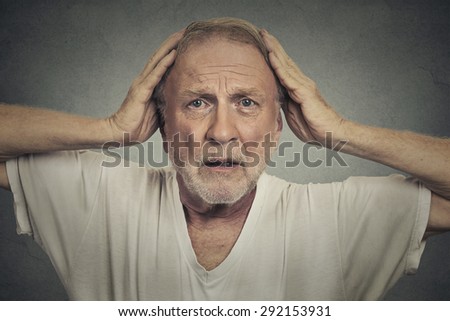 Shocked sad senior man