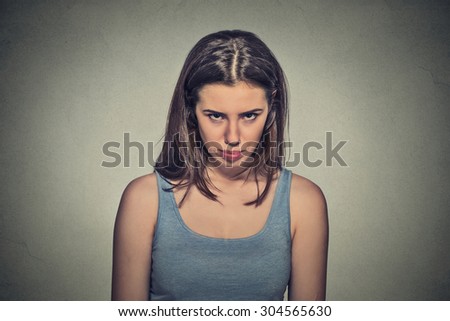 Closeup portrait angry young woman about to have nervous atomic breakdown isolated on gray wall background. Negative human emotions facial expression feelings attitude