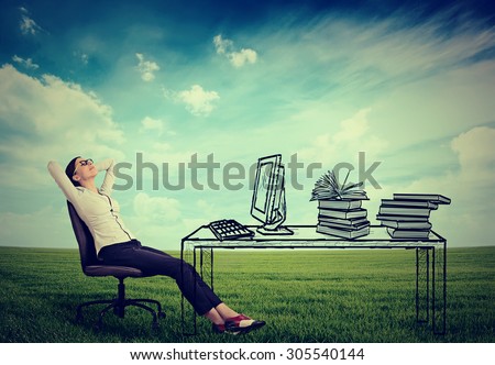 young businesswoman relaxing sitting in the office in the middle of a green meadow. Stress free working environment concept