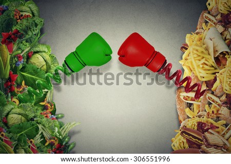 Vegetarian food fighting unhealthy junk food with boxing gloves punching each other. Diet battle nutrition concept.
