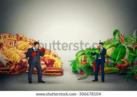 Vegetarian food representative fighting unhealthy junk fatty food guy with boxing gloves ready to punch each other. Diet battle nutrition concept idea