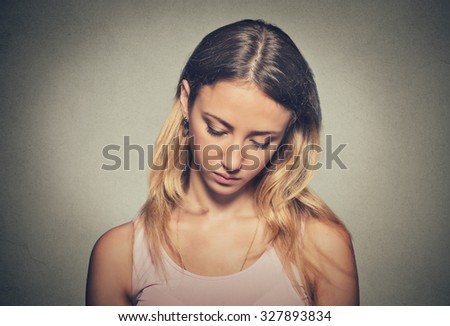 Beautiful woman with sad expression looking down