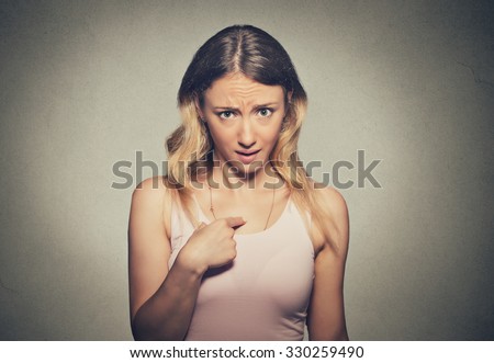 Closeup portrait of angry, unhappy, annoyed young woman, getting mad, asking question you talking to me, you mean me? Isolated gray background. Negative human emotions, facial expressions