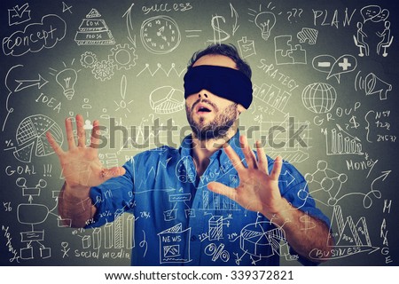 Blindfolded young business man searching walking through complicated social media financial data plan. Sightless entrepreneur analyst managing corporate unknown  financial economy risk concept