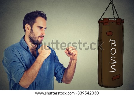 man ready to punch boxing bag with word boss written on it. negative emotion feelings. Employee employer relationship concept