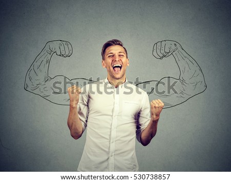 Successful business man winning fists pumped celebrating success flexing muscles isolated gray wall background. Positive human emotion facial expression. Life perception