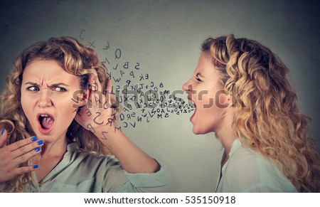 Split personality. Angry woman screaming at scared shocked herself