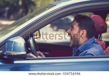 Side profile angry driver. Negative human emotions face expression