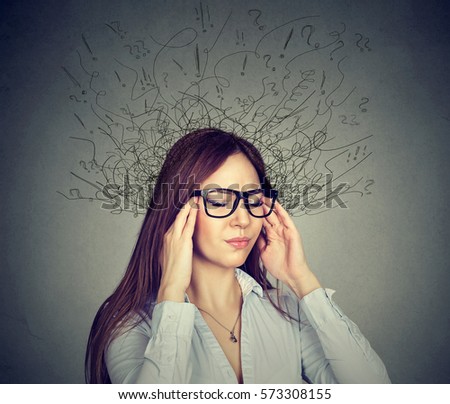 Portrait stressed young business woman having headache with worried face expression and brain melting into many lines question marks. Obsessive compulsive, anxiety disorders  concept