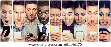 Multicultural group of young people men and women looking shocked at mobile phone