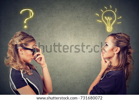 Two women thinking one has a question another solution with light bulb above head isolated on gray background.