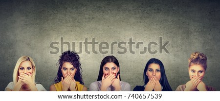 Group of multicultural women covering their mouth scared to speak out about abuse and domestic violence