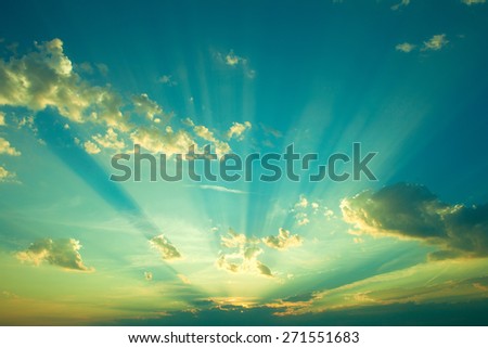 Sunrise with strong color clouds light rays and other atmospheric effects