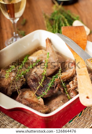 Rabbit stewed with white wine and herbs