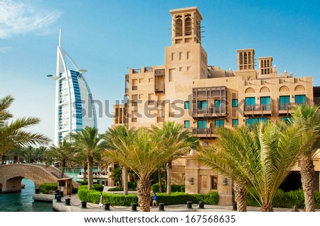 DUBAI - JUNE 3: The famous hotel and tourist district of Madinat Jumeirah 3, 2013 in Dubai. Built with ancient style, has many shops, restaurants and viewing platforms on Burzh al Arab