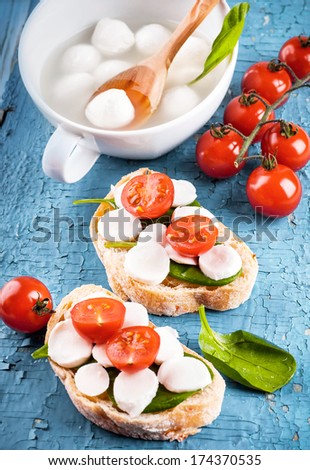 Mozzarella, tomatoes and bread. Italian food