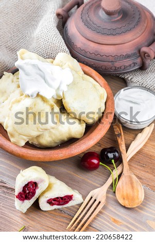 Ukrainian dumplings with cabbage, cheese and cherries
