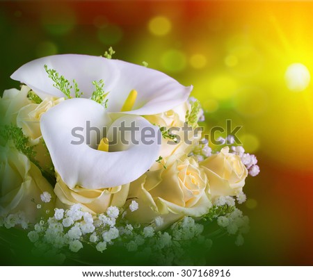 Bouquet for the bride of yellow roses and white calla lilies, floral background.