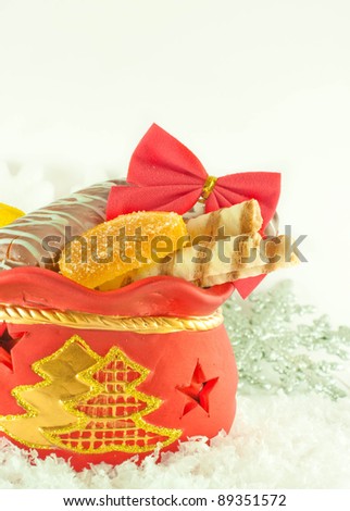 Christmas bag with gifts, cookies and fruit candy, a gift