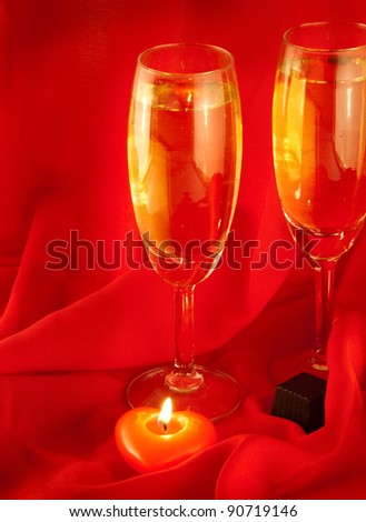 Celebratory table layout with red napkins and candles in the form of heart