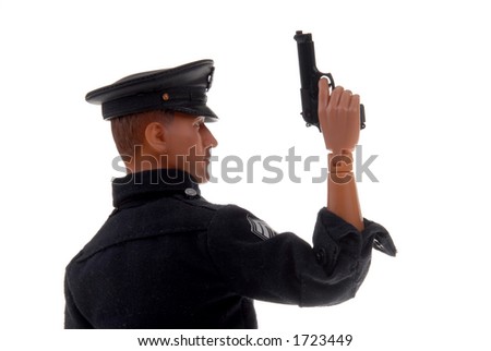 plastic toy police officer with gun in hand
