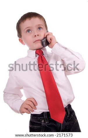 young boy making a business call on a cell phone on a white background