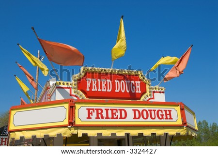 Carnival Fried dough Sign with a blue sky background