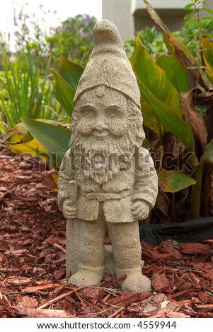 Garden Gnome on Garden Gnome Standing In A Flower Bed Stock Photo 4559944