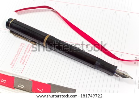 Fountain pen on personal organizer