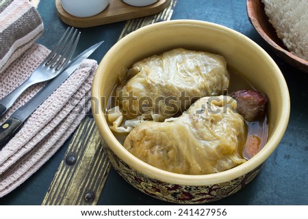 Stuffed cabbage rolls with minced meat in ceramic bowl