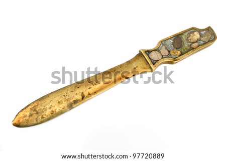 Antique letter opener brass knife isolated on white