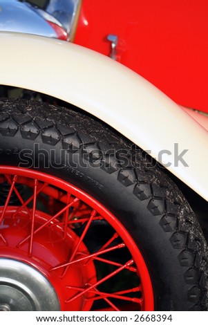 stock photo Detail of vintage British car fender wheel and tire