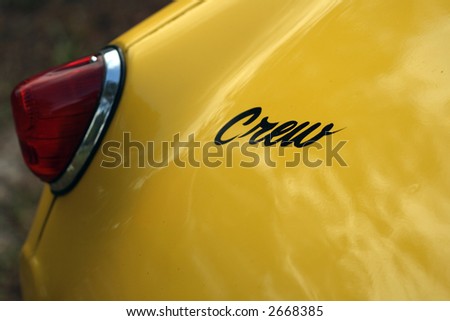 Rear brake light detail on British sports car with crew decal