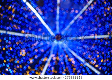 Blurred blue and Yellow twinkle Background shoot from inside of christmas tree