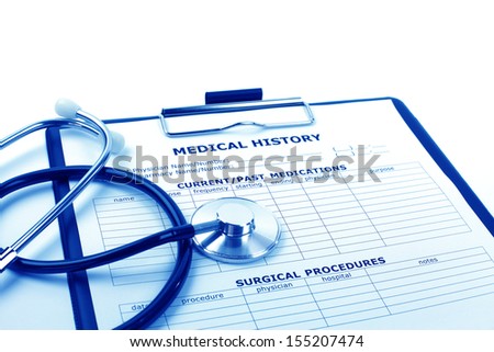 Medical concept : stethoscope and medical history form on clipboard.