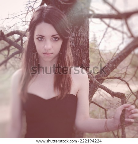 beautiful sensual woman in wood harmony with nature
