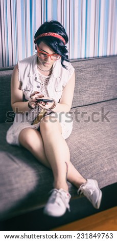 girl hipster have fun in vintage style fond of phone