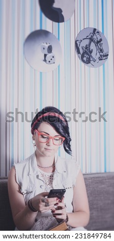 girl hipster have fun in vintage style fond of phone