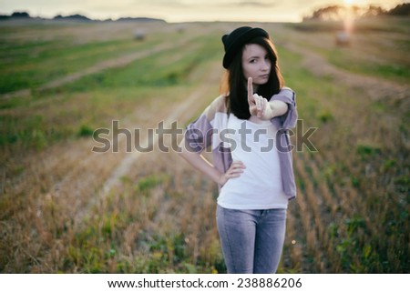 young beautiful free sad woman hipster in fall field