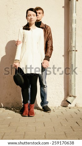 modern couple of hipsters in love walk on the European streets